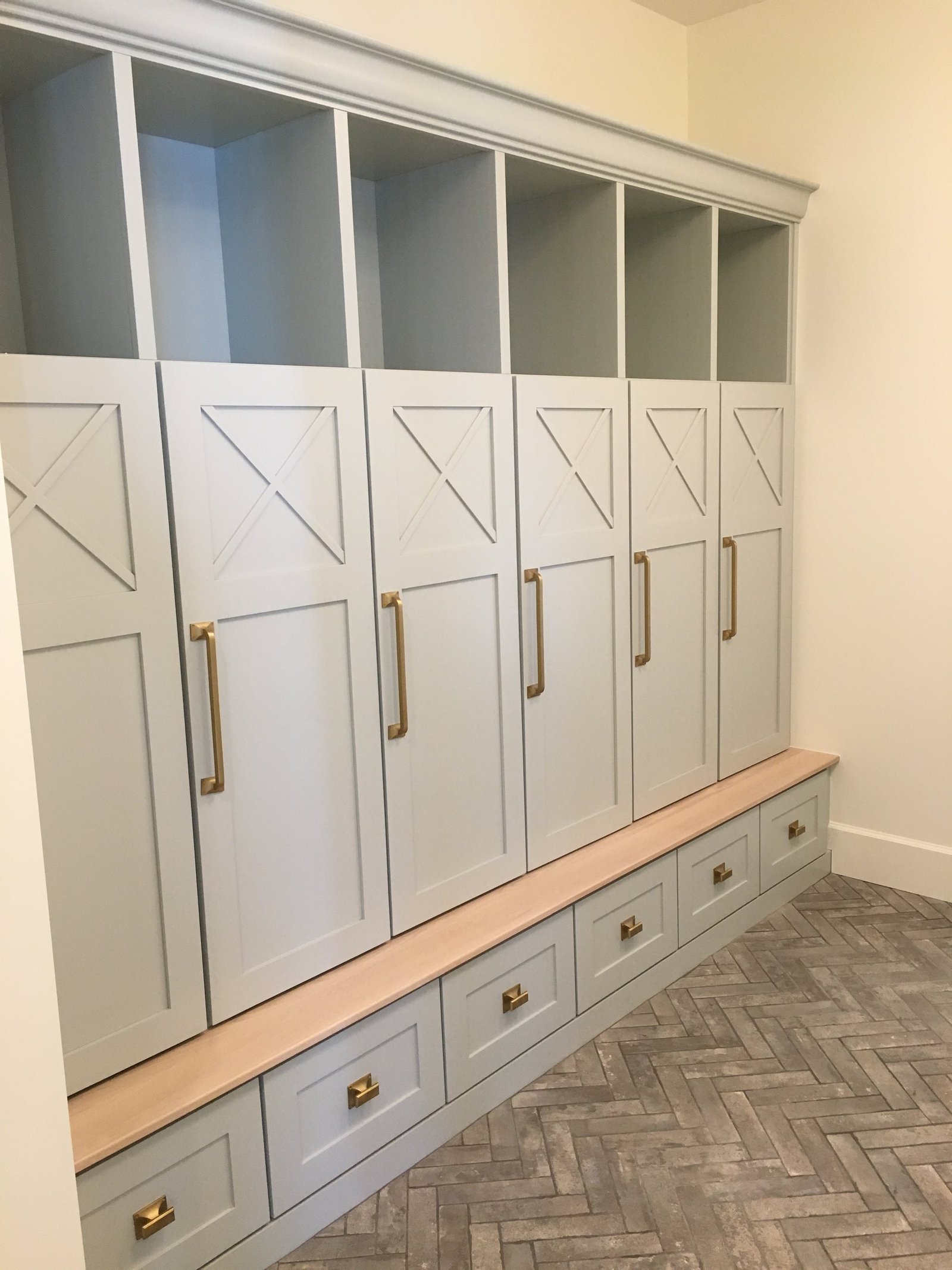 Herringbone brick floor in a mudroom